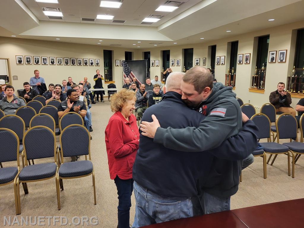 A proud father congratulates his son.