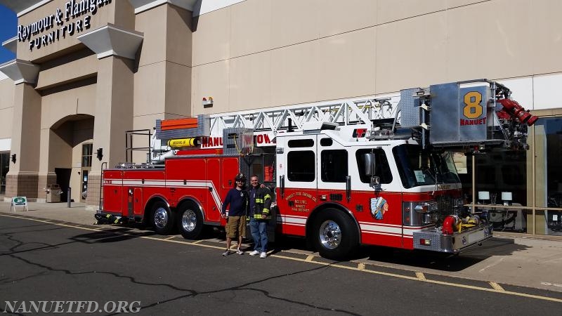 Nanuet Fire Department visit Raymour and Flanigan to help with a fundraiser for hi Tor Animal Shelter.