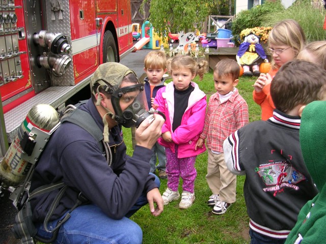 FF Jason Schlesinger teaches fire prevention to local children. 10/29/06