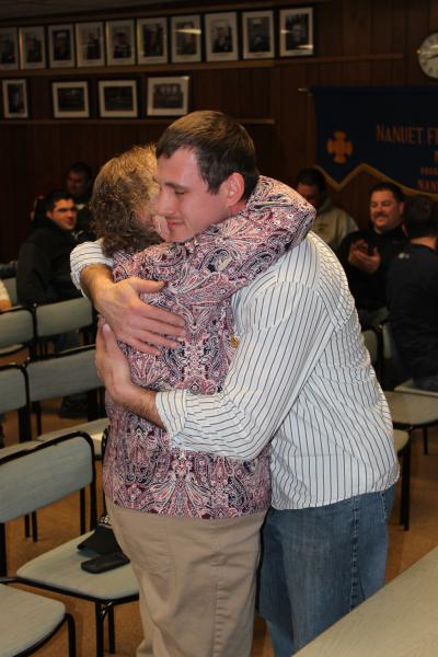 A very proud moment as Todd Giraudin receives his Chief's Badge from his mother January 8, 2015. Following in his Dad's footsteps. Ernest Giraudin. Chief 1994-1995

